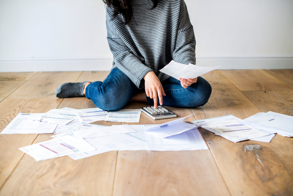 Woman Managing Debt Forms Apply IVA