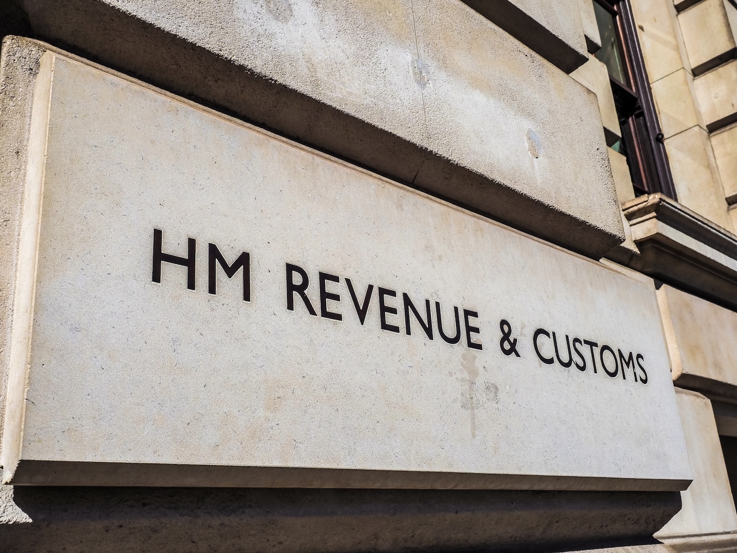 Front of HMRC building illustrating HMRC Income Tax Arrears Debt